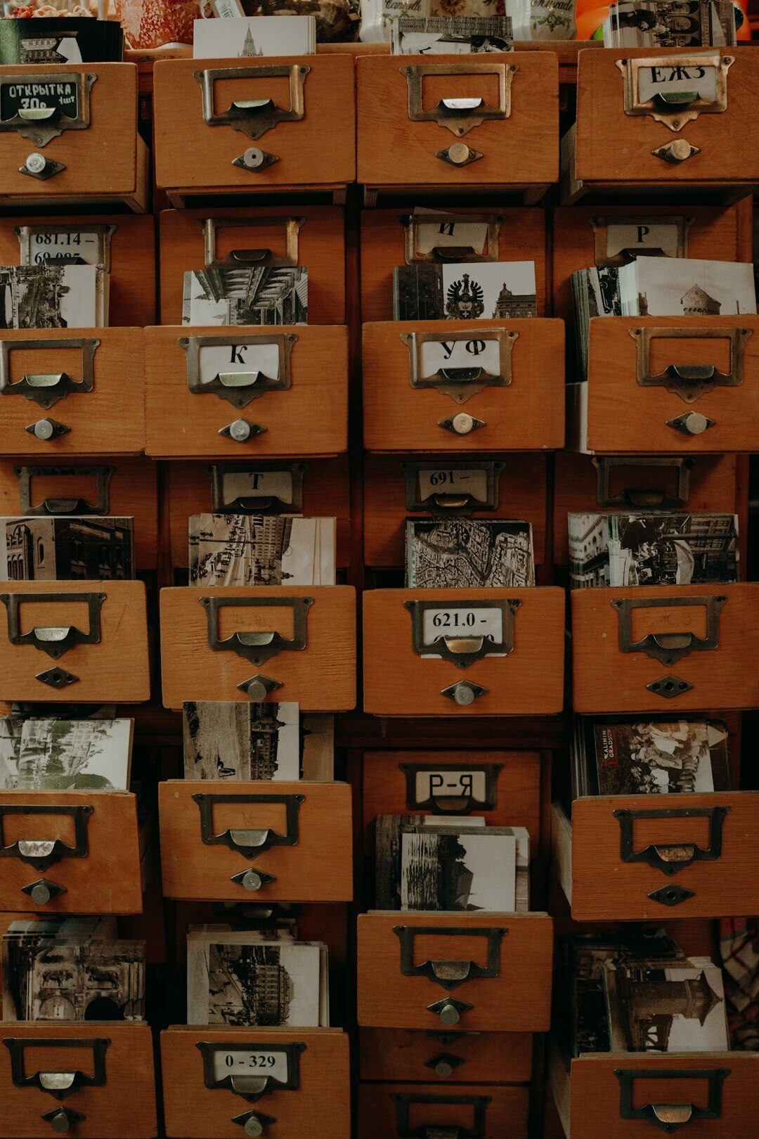 Old film reels and vintage photographs archive drawer